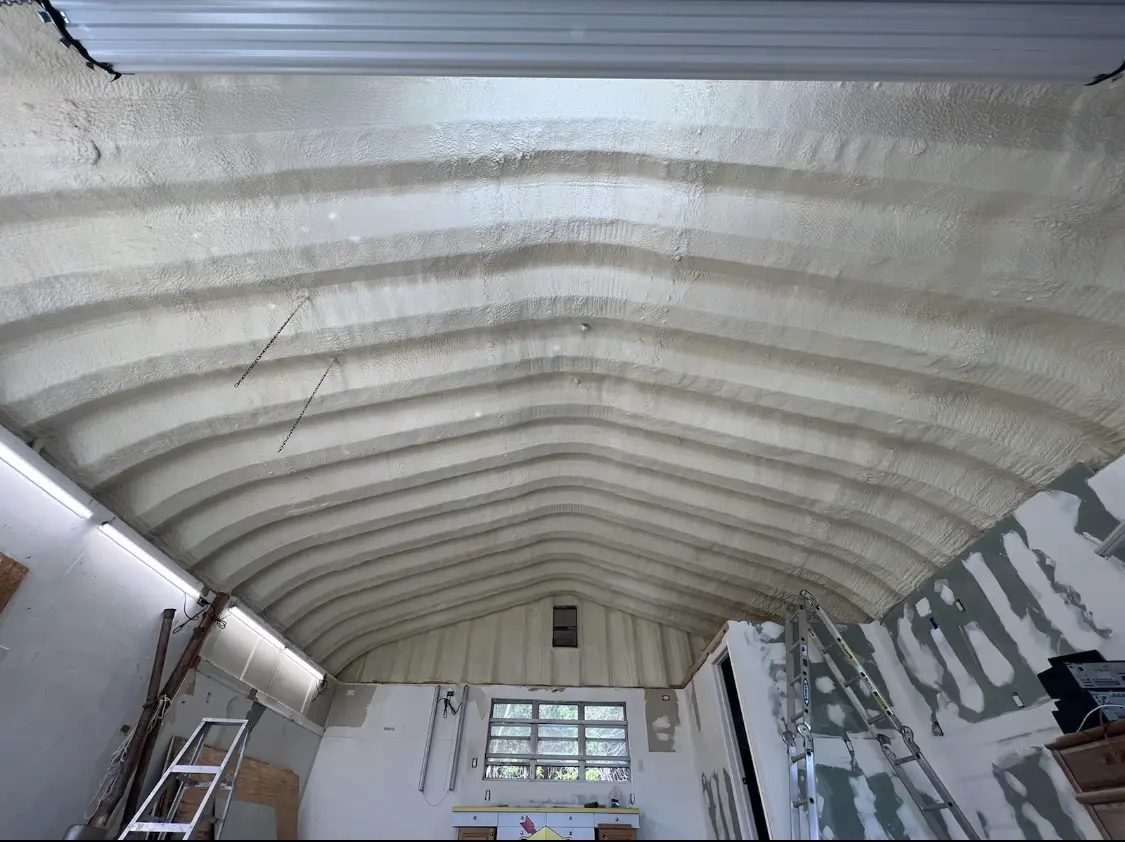 Spray polyurethane foam applied to the underside of a metal roof deck in Hunters Creek